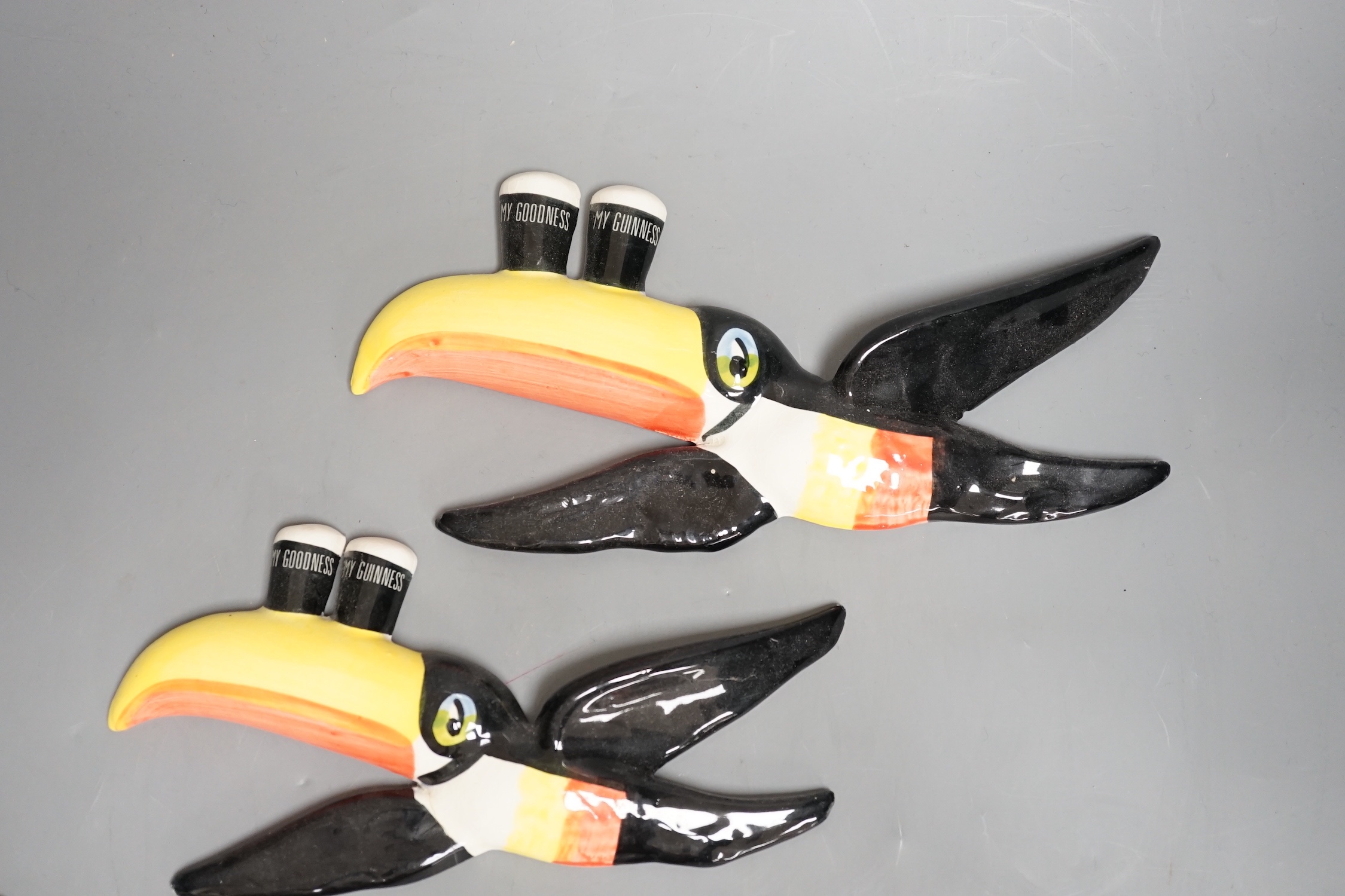 A graduated set of three Carlton ware toucan wall plaques